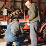 Iver helps me remove a wheel from my small yard tractor.
