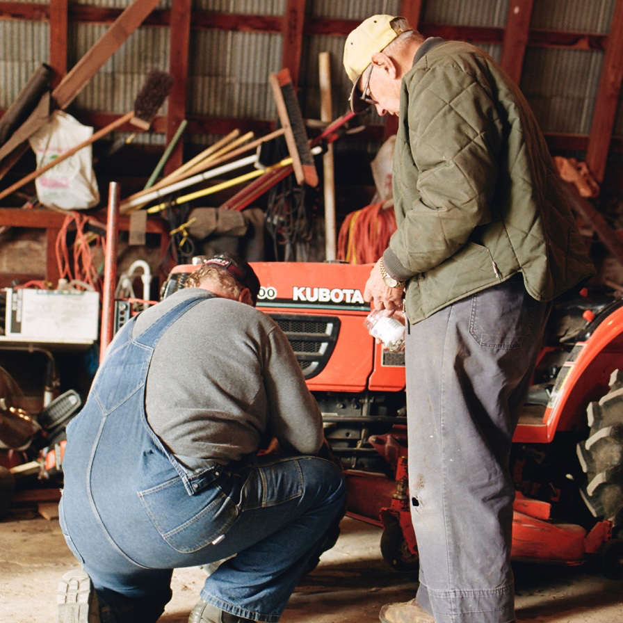 Iver helps me remove a wheel from my small yard tractor.