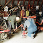 Iver helps me remove a wheel from my small yard tractor.