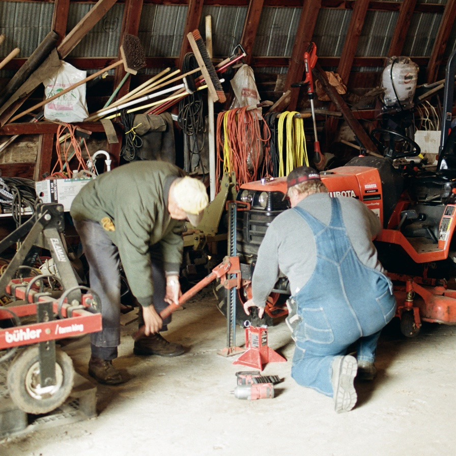 Iver helps me remove a wheel from my small yard tractor.