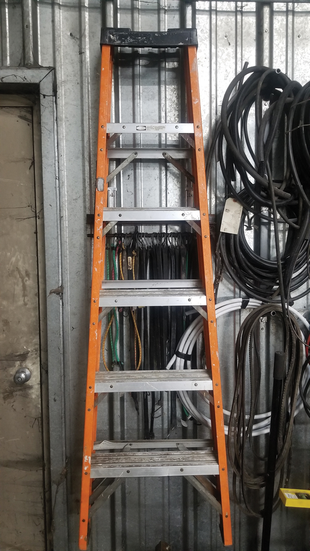 A tarp-strap and ladder rack I made out of angle iron and steel rod. It’s handy. We’ve used it a lot already.