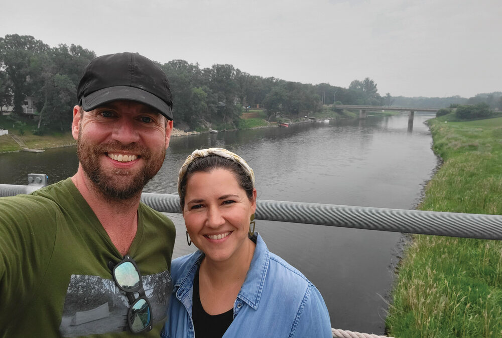 Toban and Jamie Dyck in front of the Souris River, which runs through the town and is a feature the community is proud of and has invested in. There were walkways, a park and tourist-oriented infrastructure built around the relatively wide river.