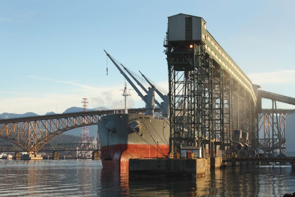 A freighter is loaded with grain from a terminal at Vancouver&rsquo;s Burrard Inlet. (Maxvis/iStock/Getty Images)
