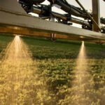 AGCO and a consortium of tech companies are involved in field trials of a spot-spray system they say will provide growers with a way to reduce inputs and save costs.