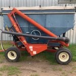 This is a side draw seed tender used to fill the grain drill John Hardman uses on the farm. It can hold up to
200 bushels of grain seed at a time. A tarp can be placed over the top of the bin to protect seed when it’s raining.