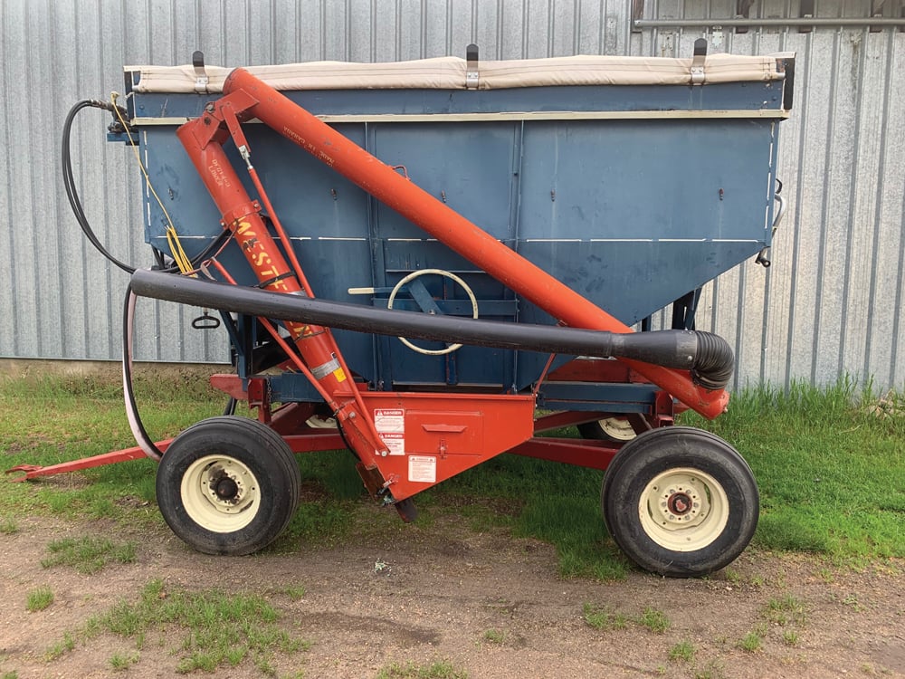 This is a side draw seed tender used to fill the grain drill John Hardman uses on the farm. It can hold up to  200 bushels of grain seed at a time. A tarp can be placed over the top of the bin to protect seed when it’s raining.