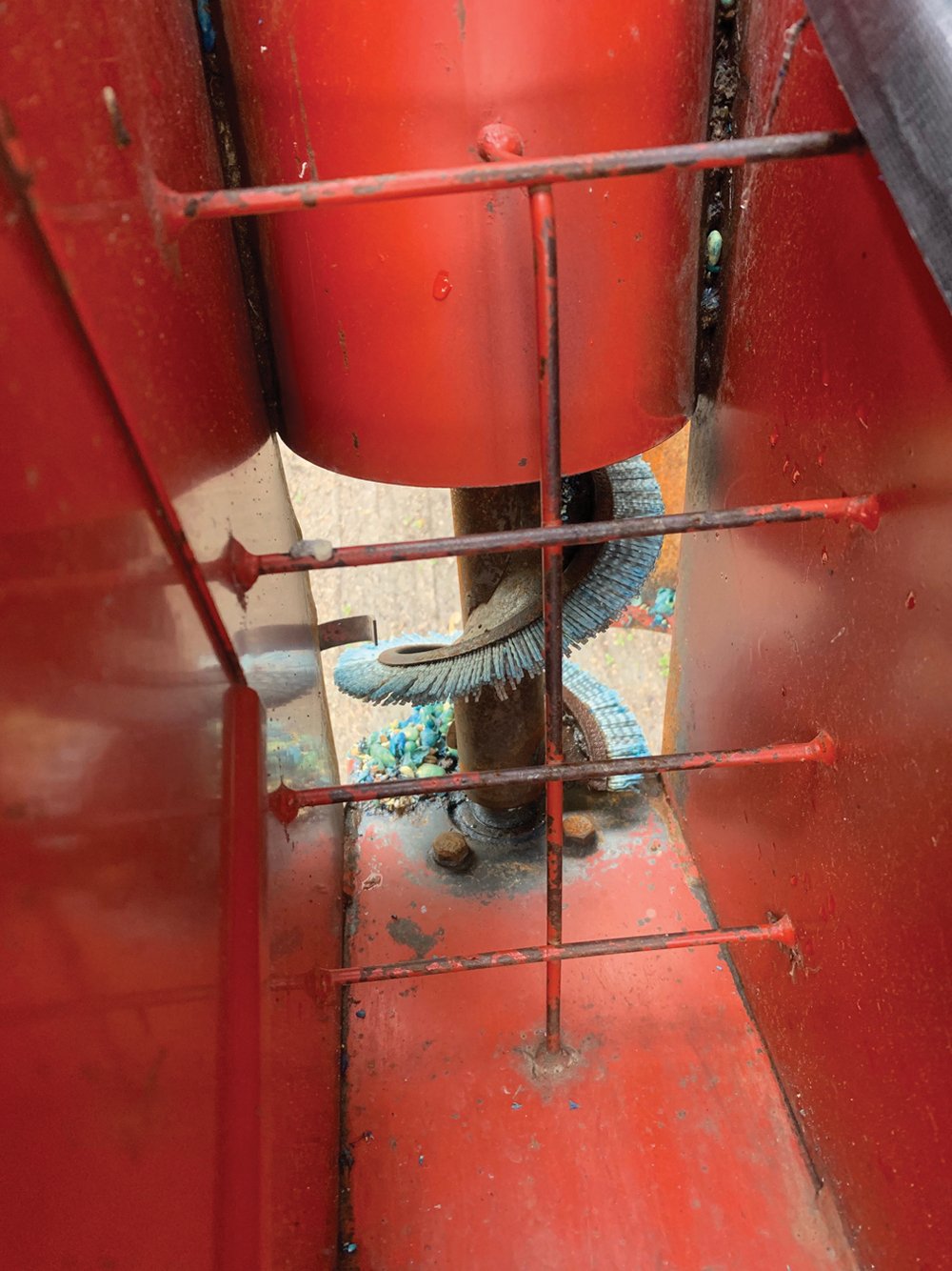 This is a look at the interior of a drill filler. Hardman says the bristles near the bottom of the device help to gently lift seed for soybean and peas without cracking them unlike many regular augers, which can damage seed and prevent it from growing.