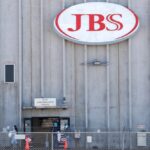 Employees walk around with face masks at the JBS USA meat packing plant at Greeley, Colorado on April 14, 2020. (File photo: Reuters/Shannon Stapleton)