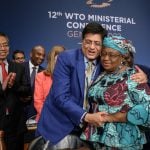 WTO director-general Ngozi Okonjo-Iweala is congratulated by India’s commerce minister Piyush Goyal after the June 17, 2022 closing session of a WTO ministerial conference in Geneva. (Photo: Fabrice Coffrini/Pool via Reuters)