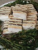Nestled atop cuttings of fresh thyme are pieces of that wonderful Icelandic and Swedish torte known as Vinarterta. A soft dough is thinly rolled into five equal portions, pricked with a fork and baked about 10 minutes until light golden brown. A cooked prune filling with other key ingredients is spread between the baked layers of Vinarterta dough sections.