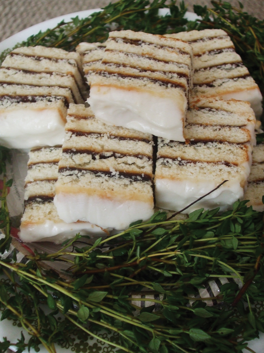 Nestled atop cuttings of fresh thyme are pieces of that wonderful Icelandic and Swedish torte known as Vinarterta. A soft dough is thinly rolled into five equal portions, pricked with a fork and baked about 10 minutes until light golden brown. A cooked prune filling with other key ingredients is spread between the baked layers of Vinarterta dough sections.