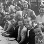 This photo shows my grandmother, then Joan
Hay, (standing up, second from right) at one of
the first VE (Victory in Europe) Day celebrations
in 1945. The street party was in front of my
grandmother’s house in Greenford, London,
England. Joan was one of the millions of children
evacuated in Operation Pied Piper.
