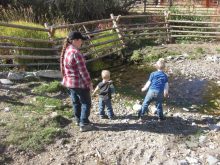 With their mom Heather close by the Eppich boys James and Joseph
visiting their great grandmother's ranch in Idaho are impressed with the
creek. While they have ponds and dug outs on their home farm in
Saskatchewan seeing a creek was somewhat of a novelty.