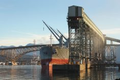 A freighter is loaded with grain from a terminal at Vancouver&#8217;s Burrard Inlet. (Maxvis/iStock/Getty Images)
