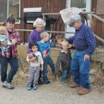 Long time columnist Heather Smith Thomas and husband Lynn, with granddaughter Heather Eppich and great grandchildren.