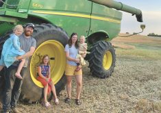 Chad, Britny, Lila, Kate and Ruby with their John Deere S670 combine.