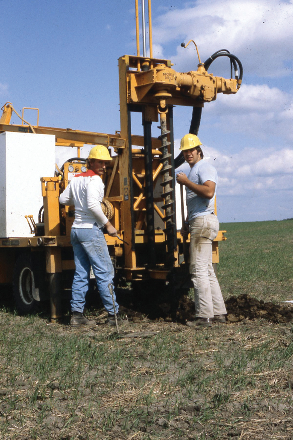 Larry Luba (left) and Paul Bullock with the Mobile drill. At the start, 45 feet was all of the augers we had, but before long a 75-foot hole was the first order of business at a new site.