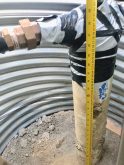 It was sort of a happy accident that the manhole creating access to waterline connections had to be dug a bit deeper. It provides more room for working. The manhole casing is a 40" diameter culvert, about 14 feet long.