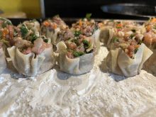 Place filled potstickers on a cornstarch-dusted tray and freeze.