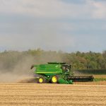 John Deere combine harvesting soybeans