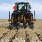 A strip tiller in action on a Farming Smarter field near Lethbridge, Alta.