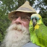 Doug Kretchmer and his parrot companion, Billy the Kid.