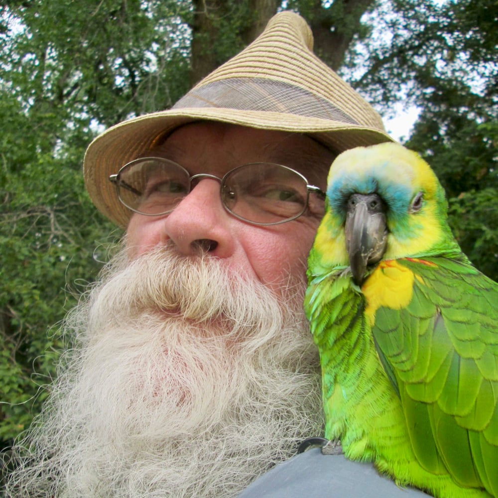 Doug Kretchmer and his parrot companion, Billy the Kid.