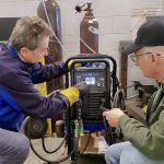 Don Duncan demonstrates Miller's Multimatic 220 AC/DC unit.