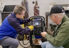 Don Duncan demonstrates Miller's Multimatic 220 AC/DC unit.