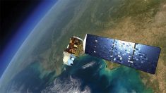 An artist's rendition of a Landsat satellite in Earth orbit.