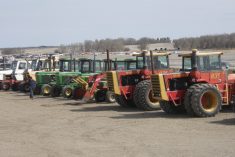 used tractors in a row at auction site