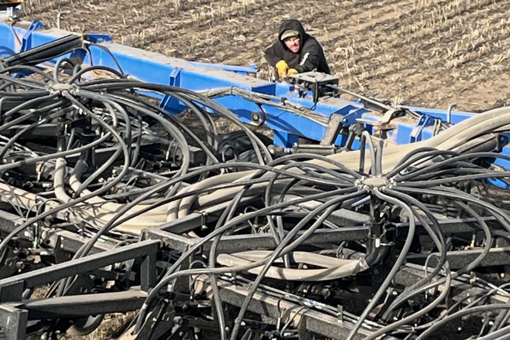 Joseph McKee preps seeding equipment at Stirling, southeast of Lethbridge.