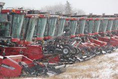 a row of case ih combines in light snow