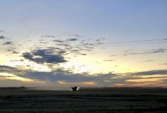 A combine in the Interlake runs against the setting sun on Nov. 1, 2022, in an effort to wrap up harvest.  Photo: Greg Berg
