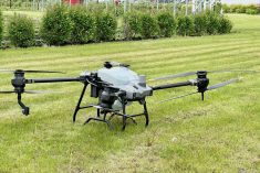 A spray drone used water to demonstrate the technology’s potential during a Prairie Fruit Growers Association farm tour in Manitoba in June.