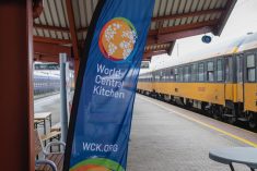 A banner for the World Central Kitchen flies where the non-profit group provides food to people transiting through a train station at Przemysl, a city on Poland's southeastern border with Ukraine, in April 2022.