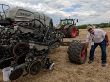 Agco marketing manager Mark Brungardt demonstrates the tire pressure adjustment system