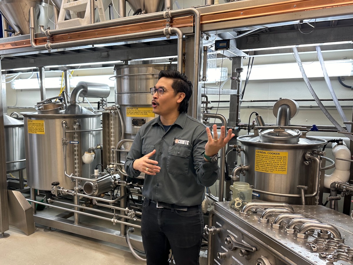 Aaron Onio, malting and brewing technical specialist with CMBTC, explains the nuances of beer making at the test brewery at the centre.