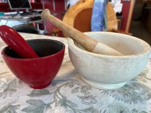 My small red mortar and pestle set is made of enameled cast iron with an unglazed interior. My larger English clay set is unglazed for good grit when pounding ingredients. Both are heavy and sturdy.