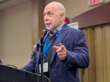 Janos Botschner, a researcher with the Community Safety Knowledge Alliance, speaks at CropConnect in Winnipeg on Feb. 12.