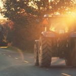 A farmer drives a tractor back home after a day in the fields of the Gaspereau Valley. Photo: Shaunl/iStock/Getty Images