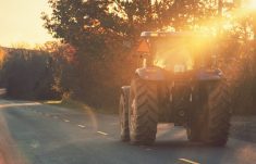 A farmer drives a tractor back home after a day in the fields of the Gaspereau Valley. Photo: Shaunl/iStock/Getty Images