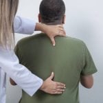 Medical doctor and massage therapist. Miragest/iStock/Getty Images 2177642786