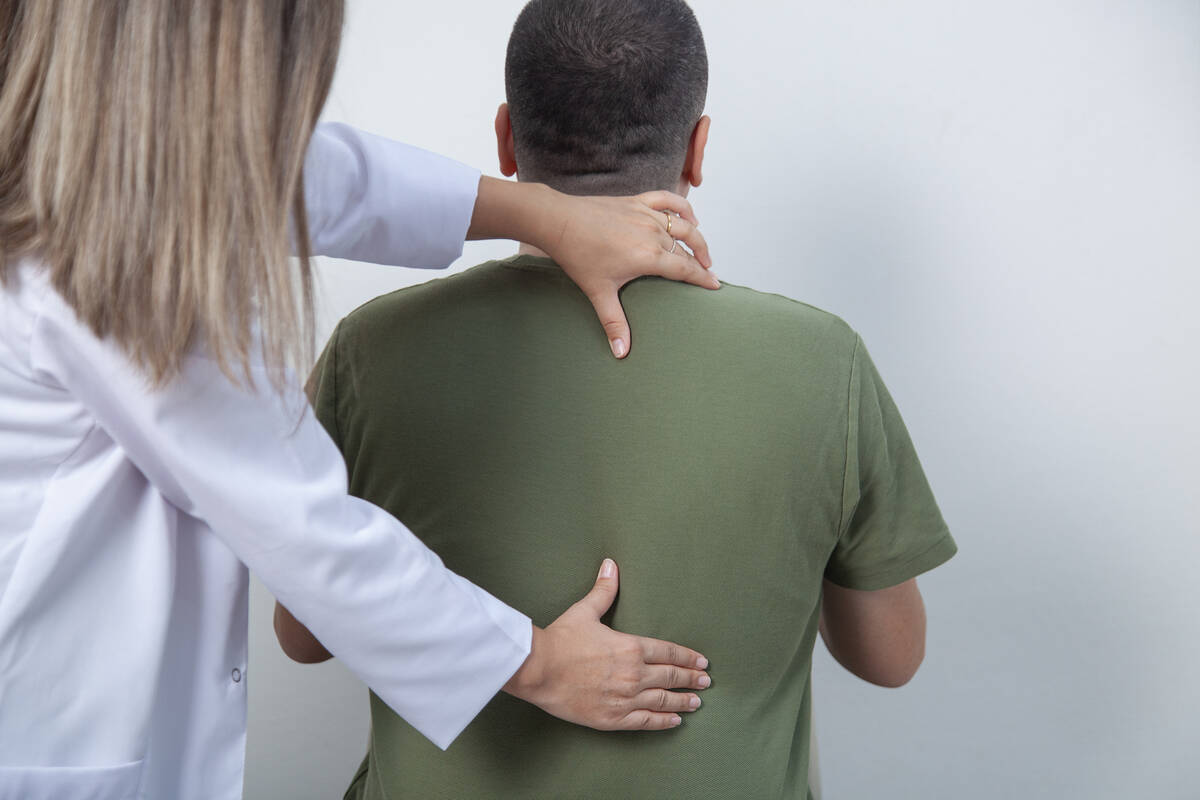 Medical doctor and massage therapist. Miragest/iStock/Getty Images 2177642786
