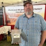 Darcy Lepine, President of Crop Growth Health, displaying his new product, PhoSul. Photo: Don Norman