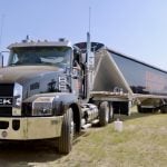 a semi-truck and trailer on the grounds at Ag in Motion