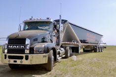 a semi-truck and trailer on the grounds at Ag in Motion