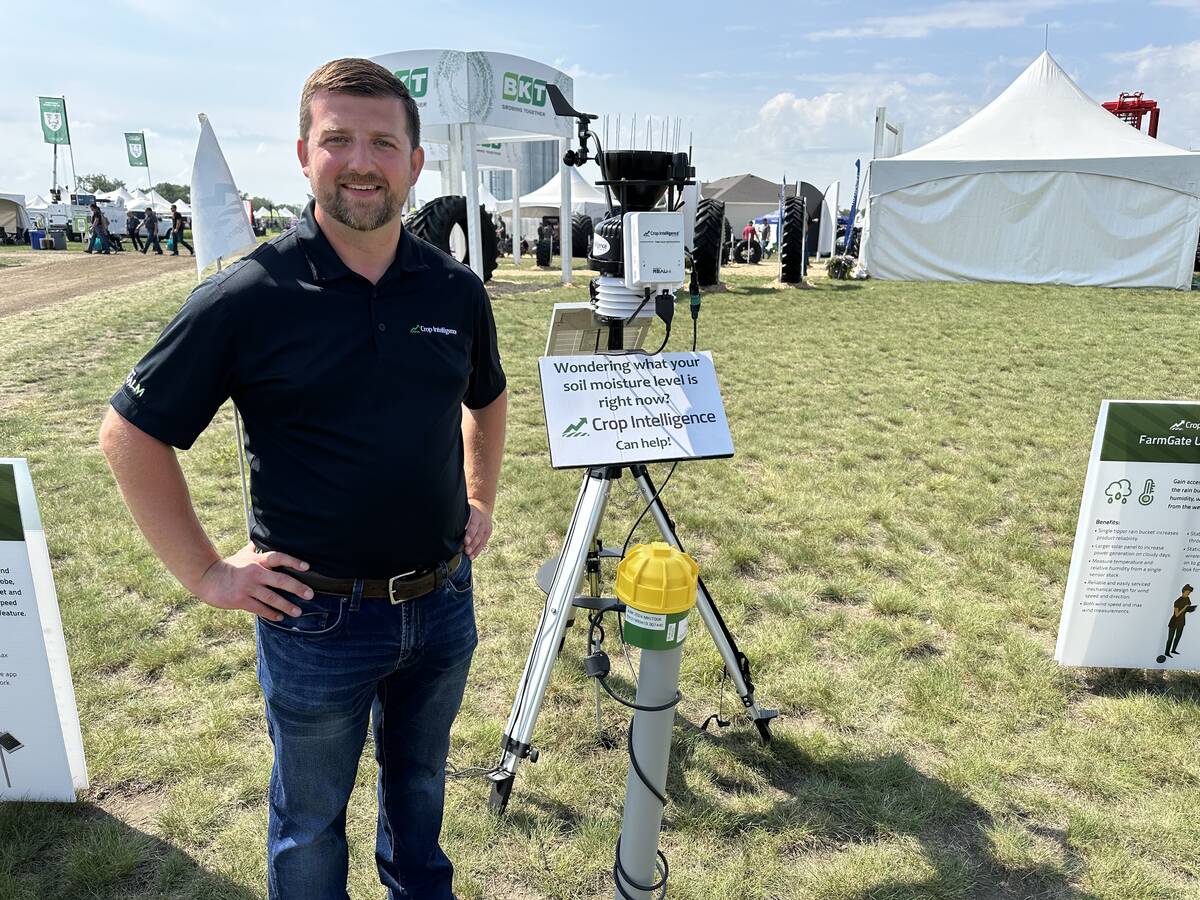 Kyle Henderson, business manager of Crop Intelligence with his company’s soil moisture probe. PHOTO: Don Norman