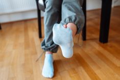 hole in blue sock Larisa Stefanuyk/iStock/Getty Images
