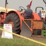 vintage Case tractor in tractor pull with front wheels off ground